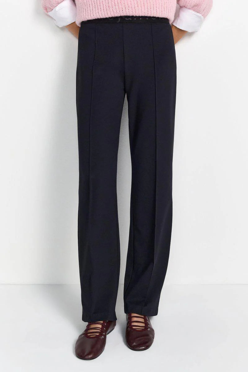 Elastic waist trousers with piping