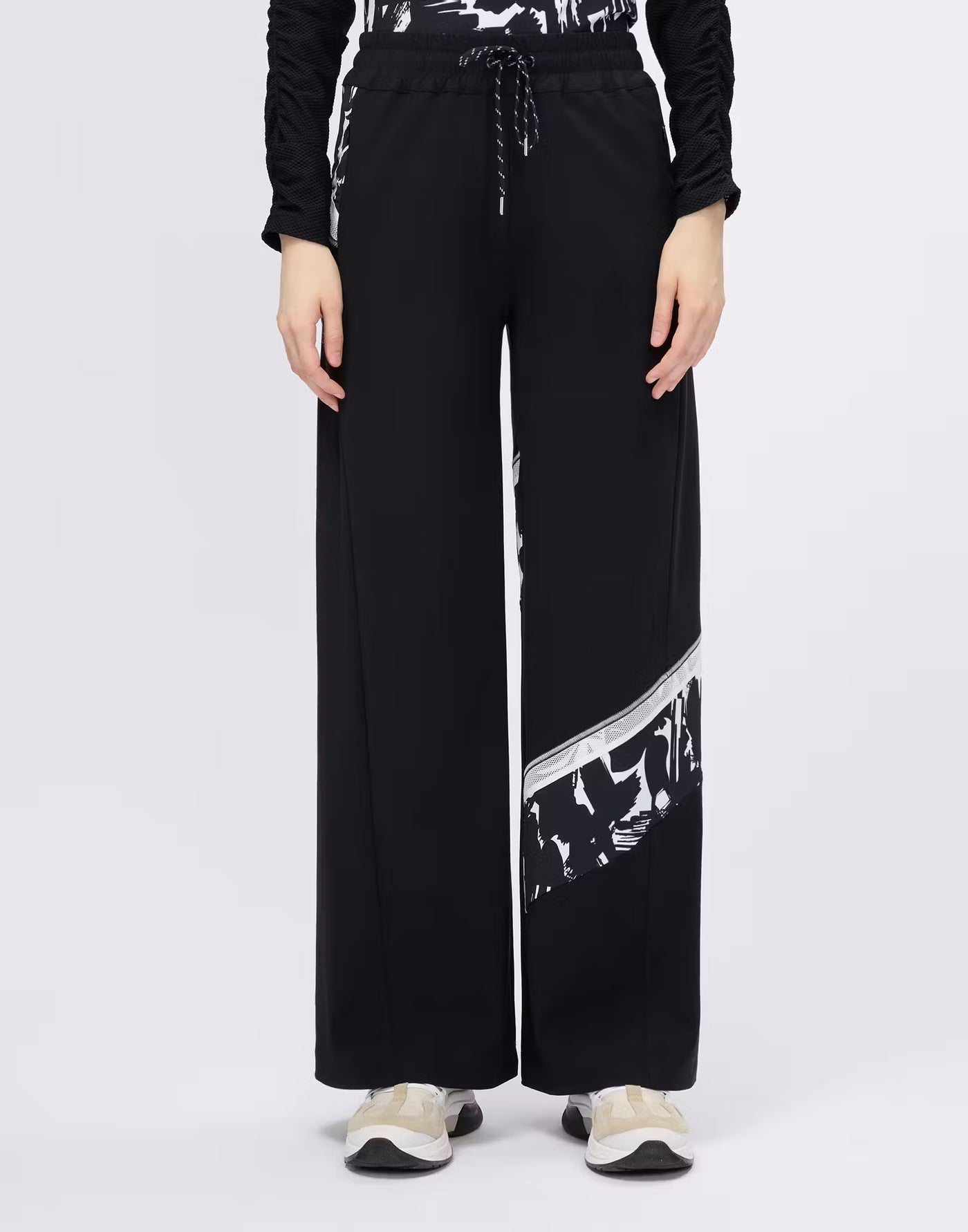 Wide-leg trousers with printed and mesh inserts