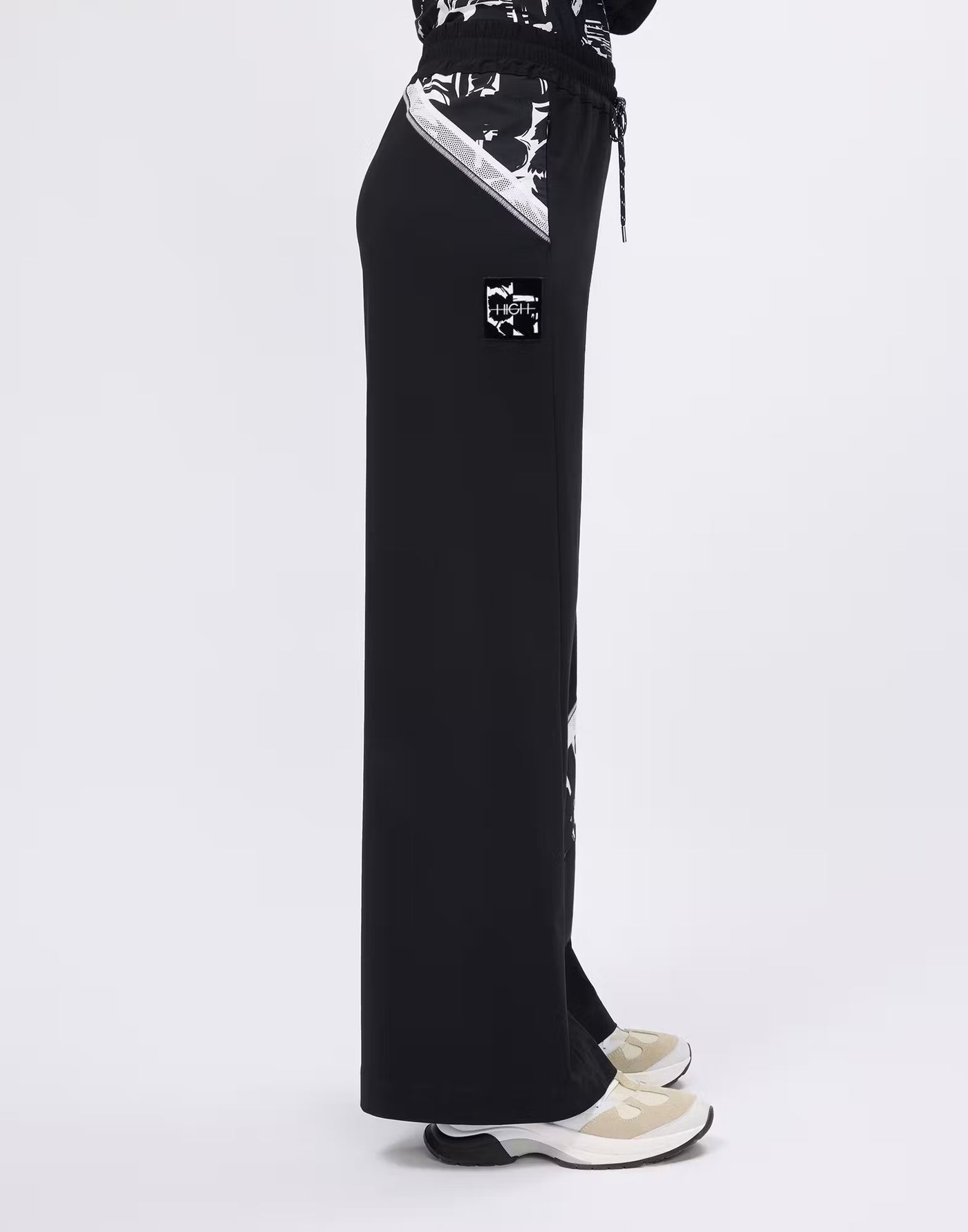 Wide-leg trousers with printed and mesh inserts
