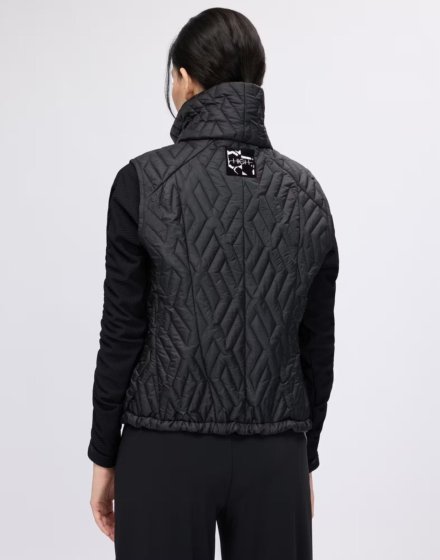 Gilet with geometric quilting