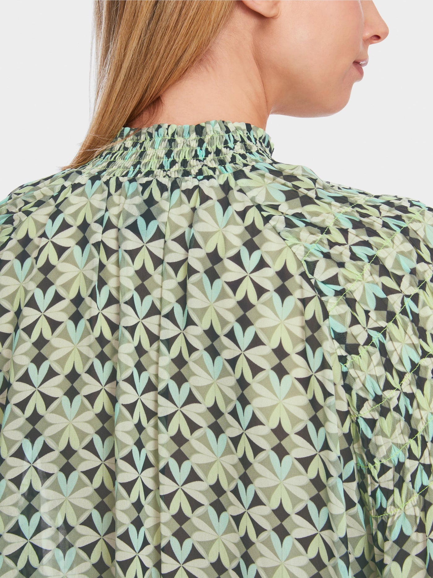 Smocked blouse with graphic pattern