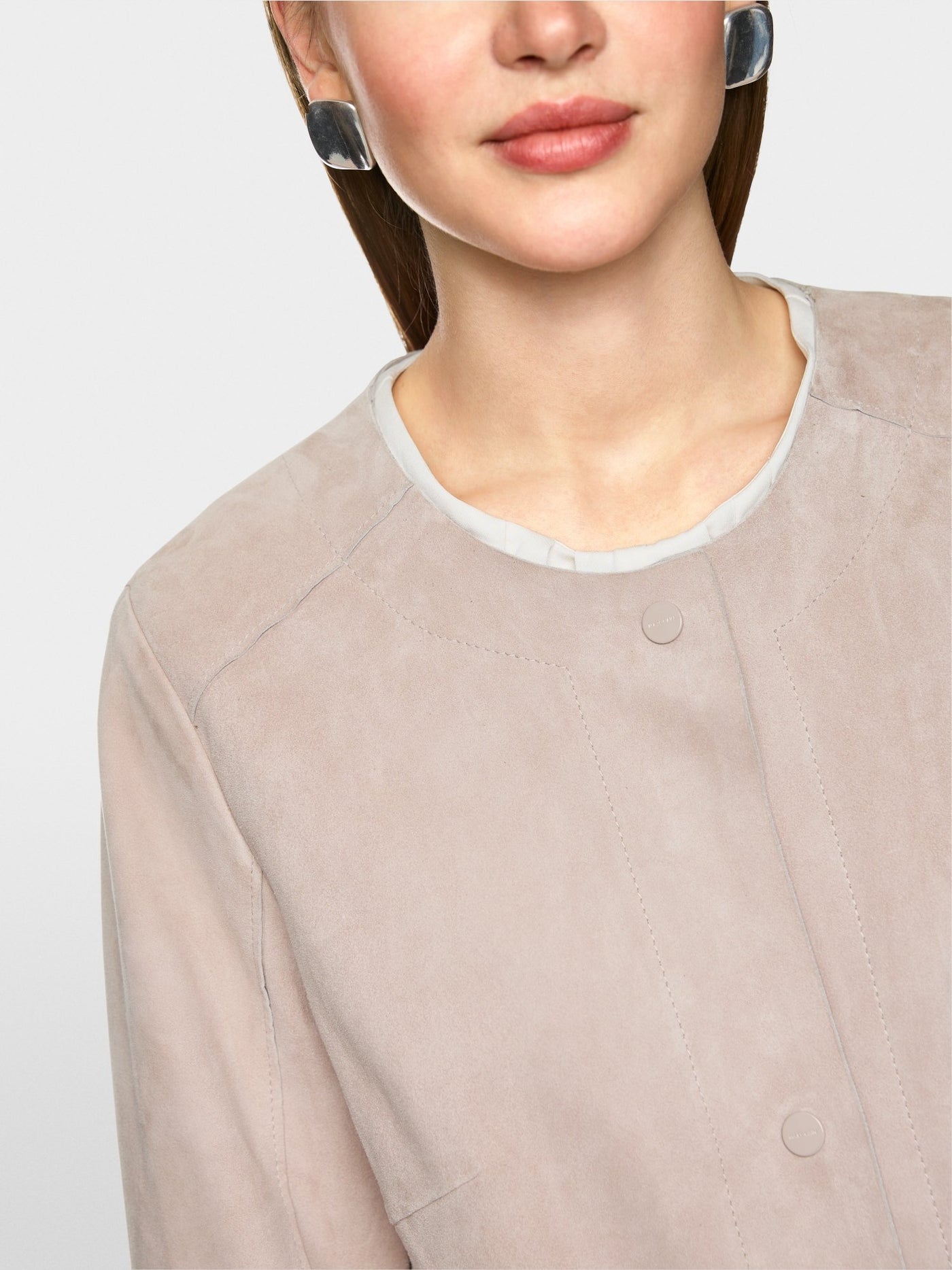 Collarless suede coat