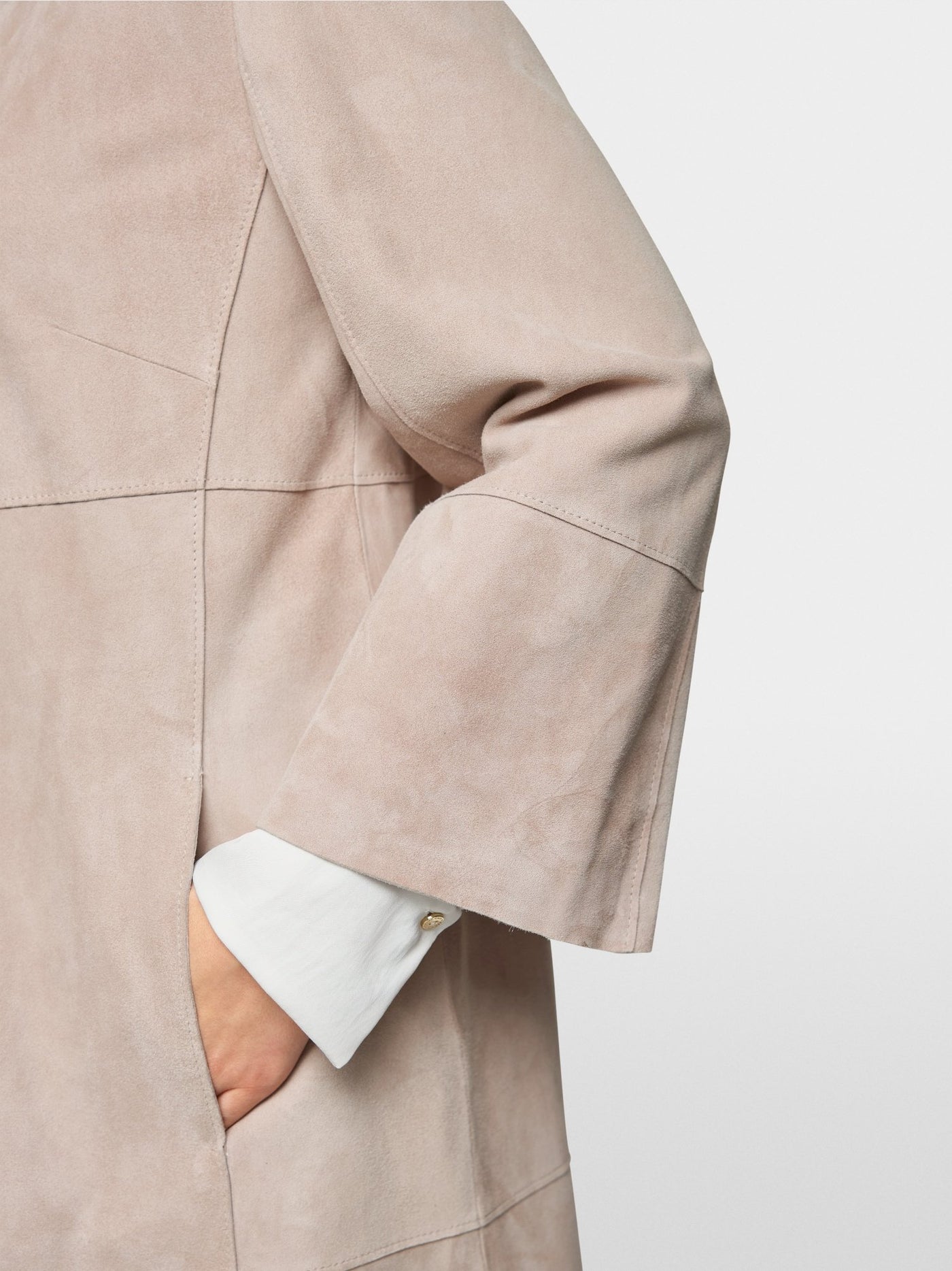 Collarless suede coat