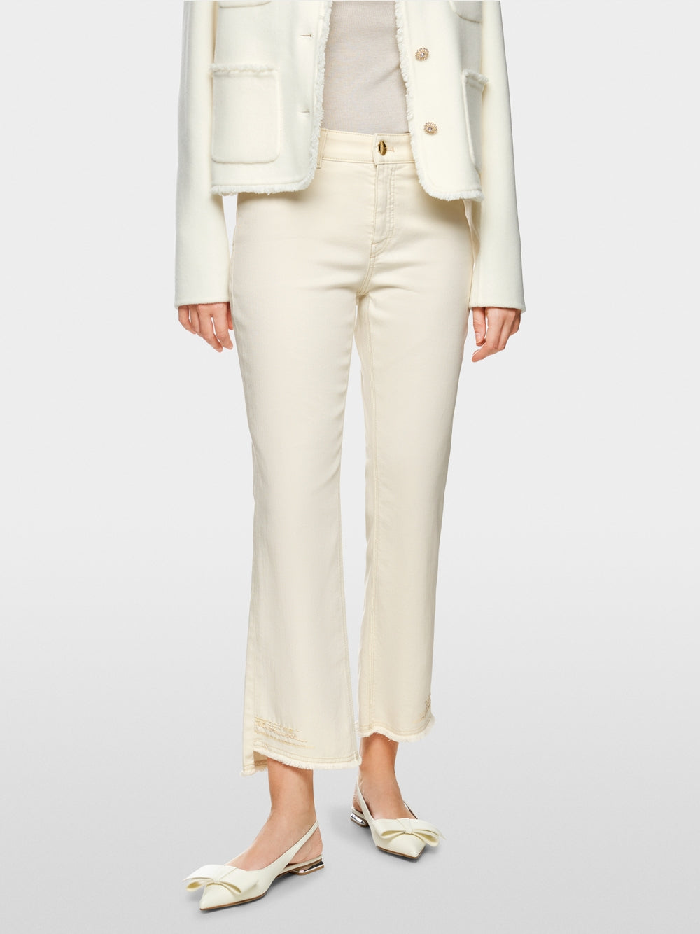 Flared and cropped jeans with embellishments