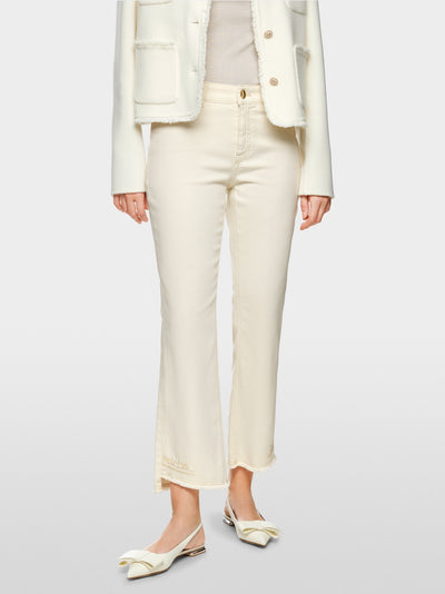 Flared and cropped jeans with embellishments