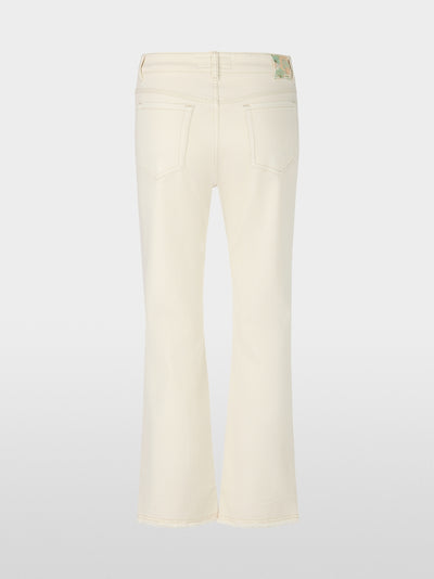 Flared and cropped jeans with embellishments